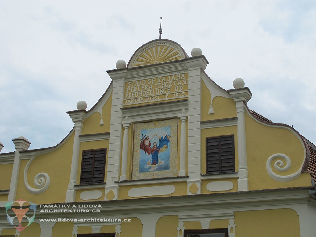 Brick gable of house with stucco decoration