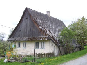 Timber buildings - structure and decoration of timber houses, barns, churches, etc. 6 House made of beams under a surface finish.
